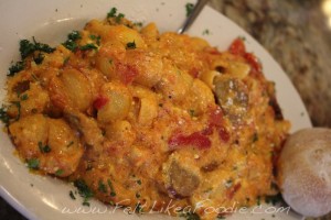 Lumache Arrosto:  Shell shaped pasta with San Marzano tomato sauce, ricotta cheese, roasted red peppers, and grilled Italian sausage.   YUM!!!