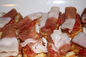 Salty cured meat with sweet tomatoes.